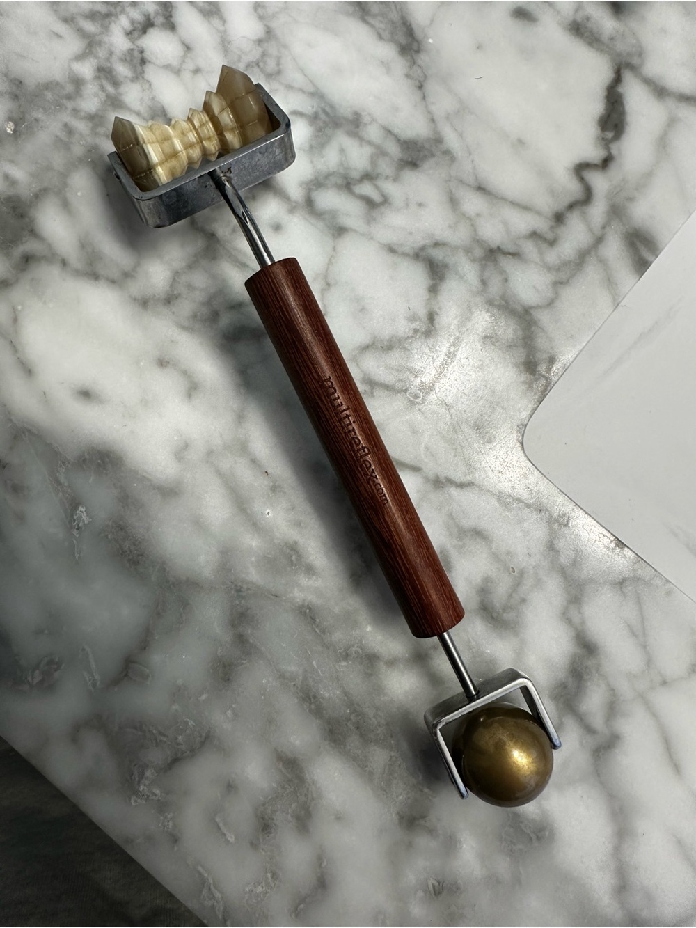 Concave Facial Roller Brown and Brass beauty tool